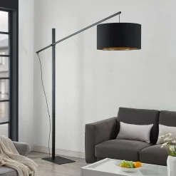 Arcchio gebogen vloerlamp Mossa, 200 cm, zwart-goud, textiel