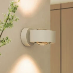 Arcchio LED wandlamp Rotari, lens, omhoog/omlaag, wit, metaal