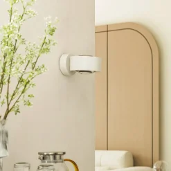 Arcchio LED wandlamp Rotari, lens, omhoog/omlaag, wit, metaal