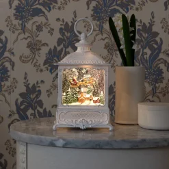 LED waterlantaarn kerstman vliegt over dorp