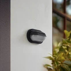 Lindby buitenwandlamp Adita, zwart, ABS, hoogte 16,3 cm