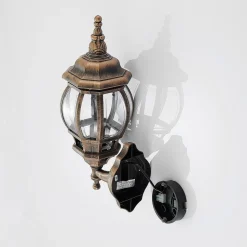 Lindby buitenwandlamp Nadesha, hoogte 47 cm, geborsteld goud
