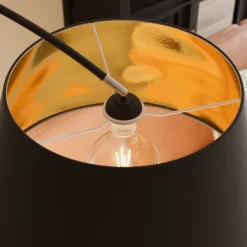 Lindby Esti vloerlamp, zwart/goud, stof, hoogte 192cm