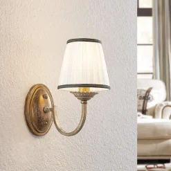 Lindby wandlamp Lumiel, crème/messing, textiel, 27cm