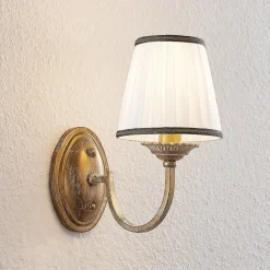 Lindby wandlamp Lumiel, crème/messing, textiel, 27cm