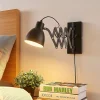 Lindby wandlamp Merle, zwart, 60 cm, leeslamp, uitschuifbaar