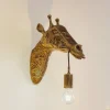 Lindby wandlamp Nirvathia, 35 cm, giraffe, messingkleurig