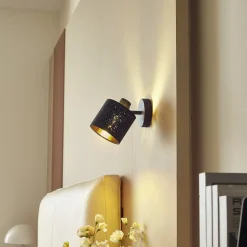 Lindby wandlamp Vasilia, Ø 12 cm, zwart/goud, stof