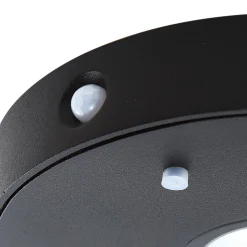 Lucande LED wandlamp Tavon, rond, zwart, sensor