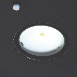 Lucande LED wandlamp Tavon, rond, zwart, sensor