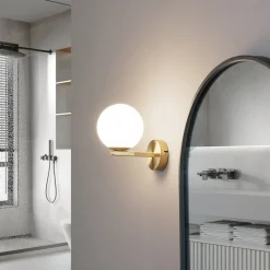 Lucande wandlamp Bidolo, messingkleurig, glas, 12 cm, IP44