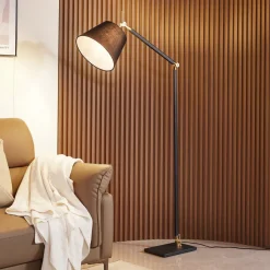 Vloerlamp Lucande Marvaine, zwart/goudkleurig, verstelbaar