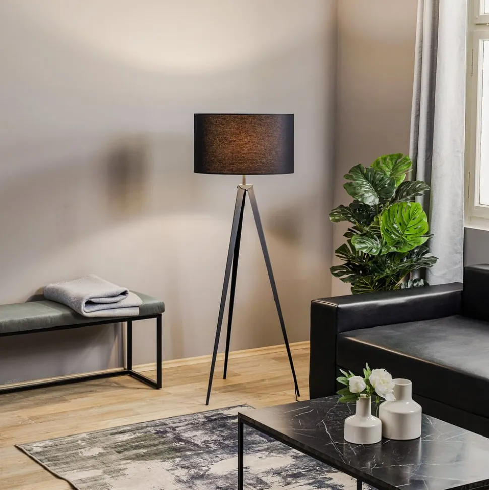 Vloerlamp Tago, driepoot, kap zwart/goud