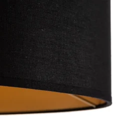 Vloerlamp Tago, driepoot, kap zwart/goud