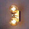 Wandlamp Neptun 2-lamps goud met glasbollen